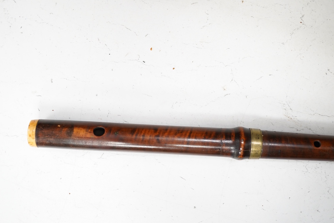 A 19th century crocus wood and ivory flute possibly by Metzler, six holes and one key to the foot joint, 60.5cm long, ivory submission ref: HMMH3U4M